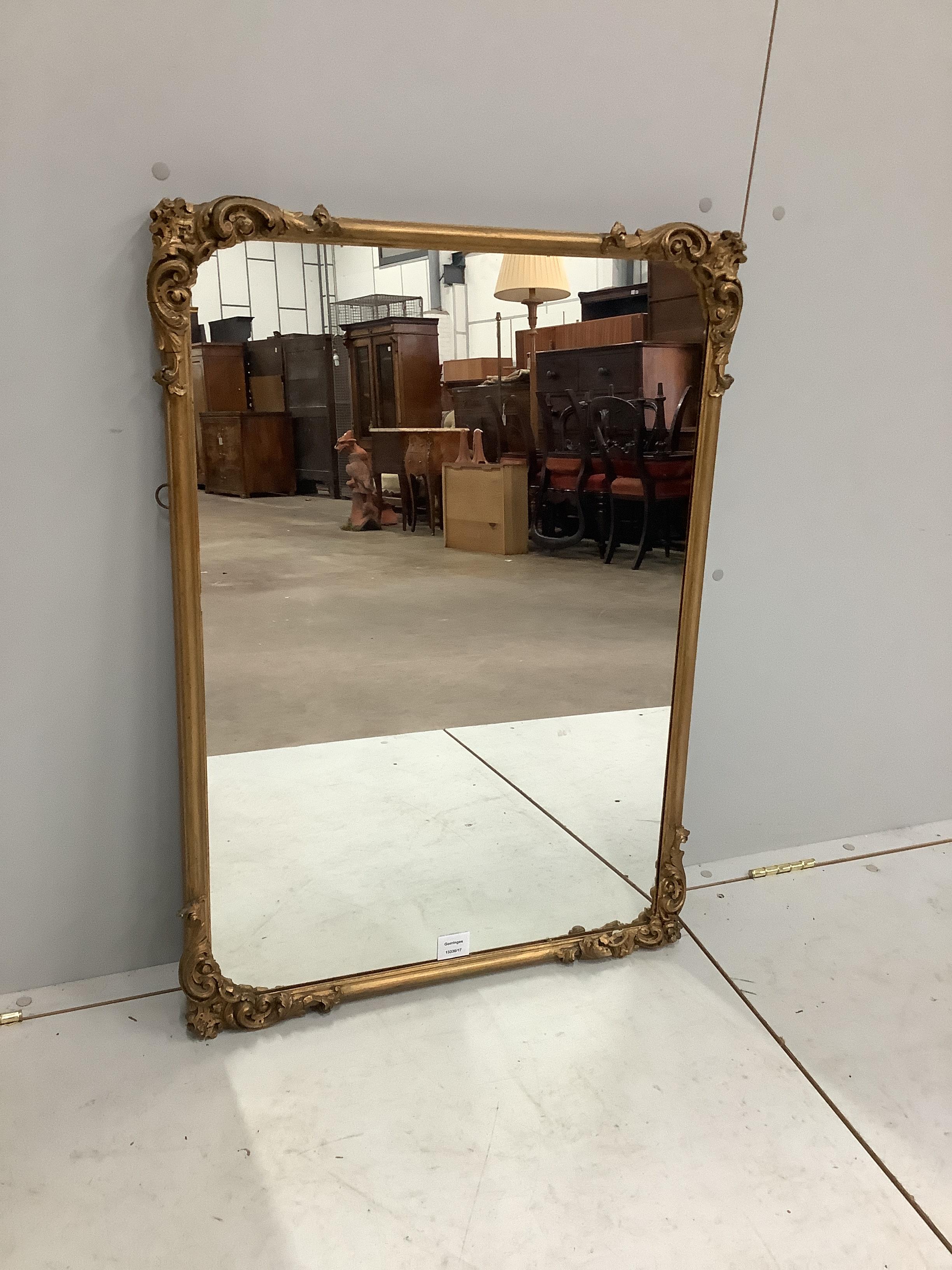 A Victorian style gilt and composition rectangular wall mirror, width 61cm, height 89cm